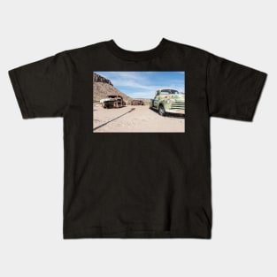 Old abandoned trucks and cars in Arizona desert Kids T-Shirt